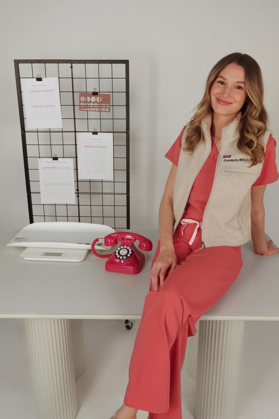Carolynn Wimmer, RN, BSN, IBCLC, with a baby scale and printable feeding logs